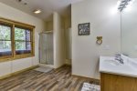 Full bathroom with walk in shower on terrace level